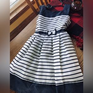 A navy blue and white striped dress perfect for Easter worn once